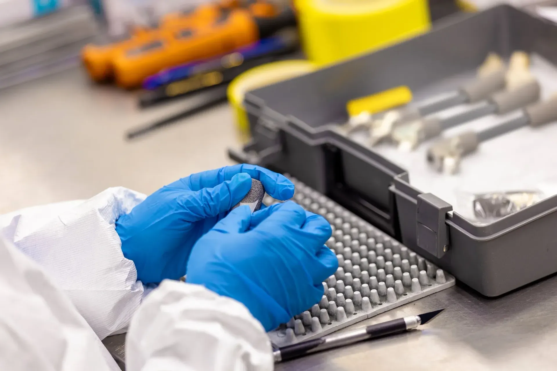 Masking an orthopedic implant ahead of coating