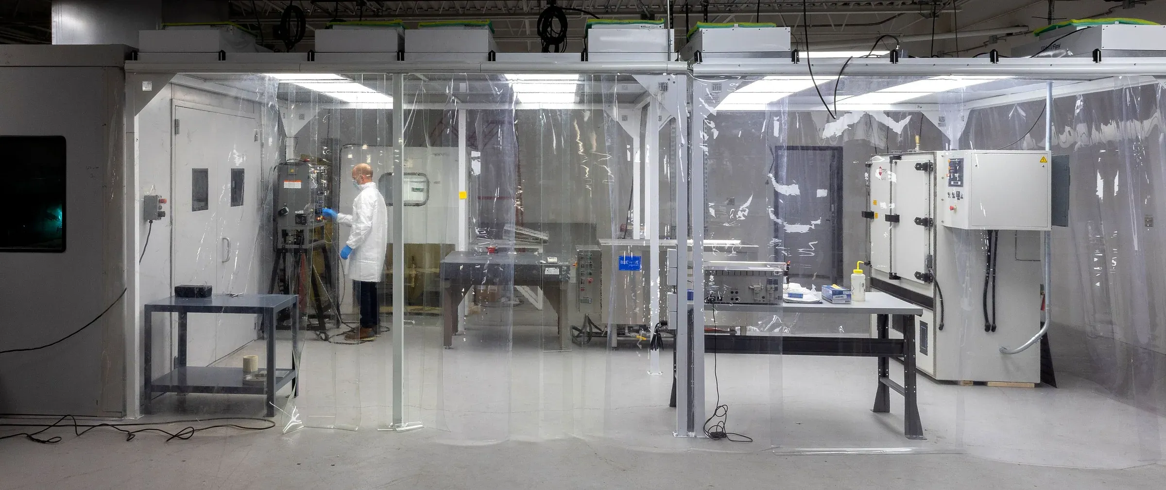 Row of enclosed thermal spray cells at the APS Materials facility