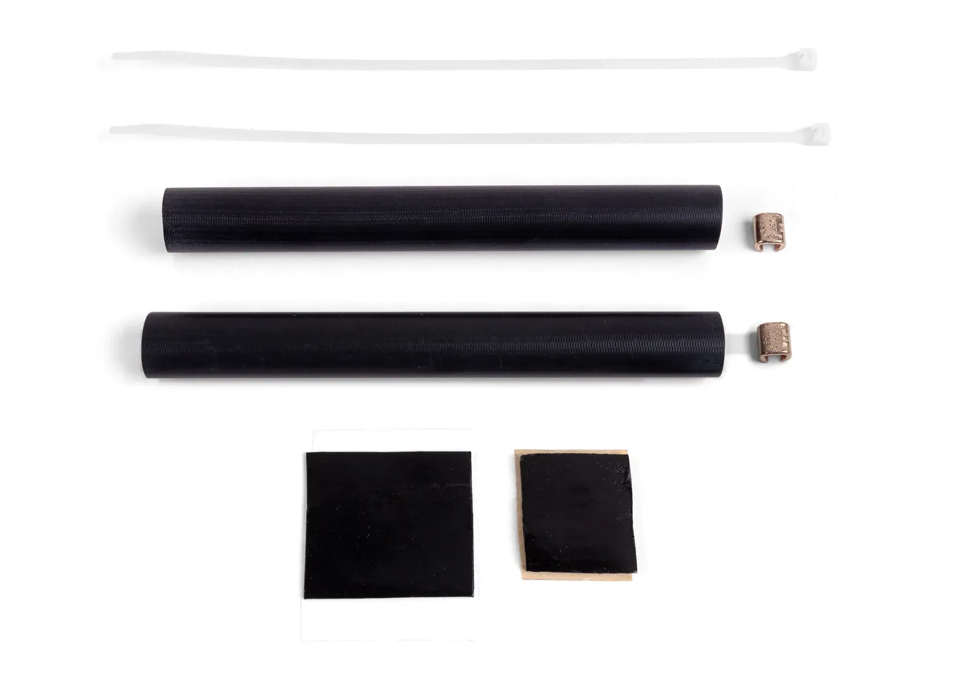 CerAnode cable splice kit laid out: heat-shrink sleeves, copper crimp connectors, mastic patches and cable ties