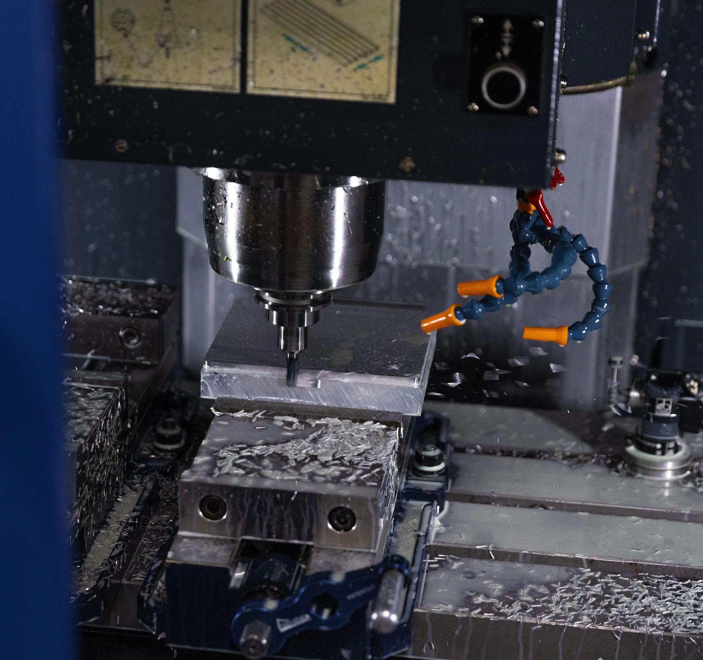 Machinist operating a CNC vertical milling center