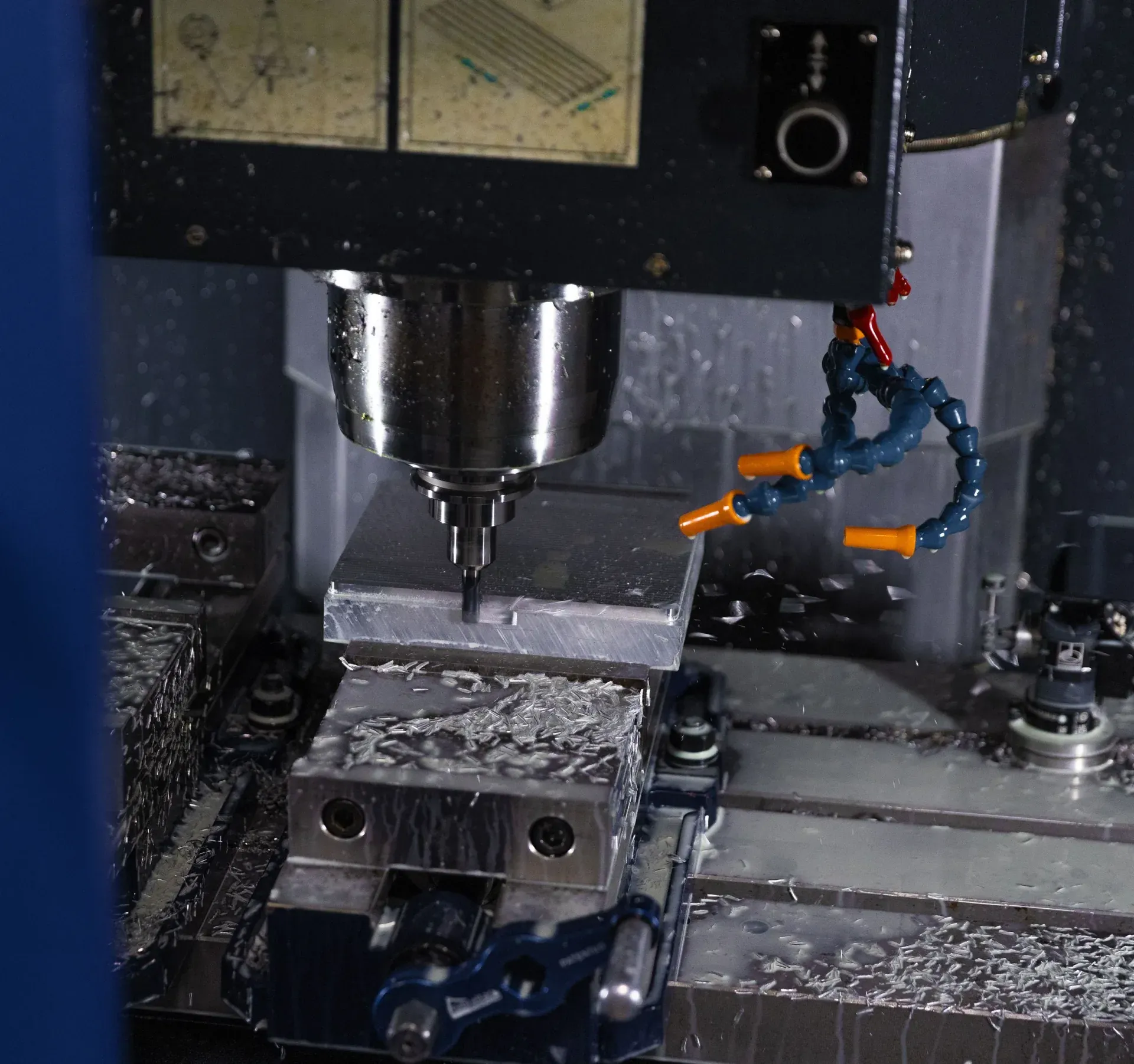 Machinist operating a CNC vertical milling center