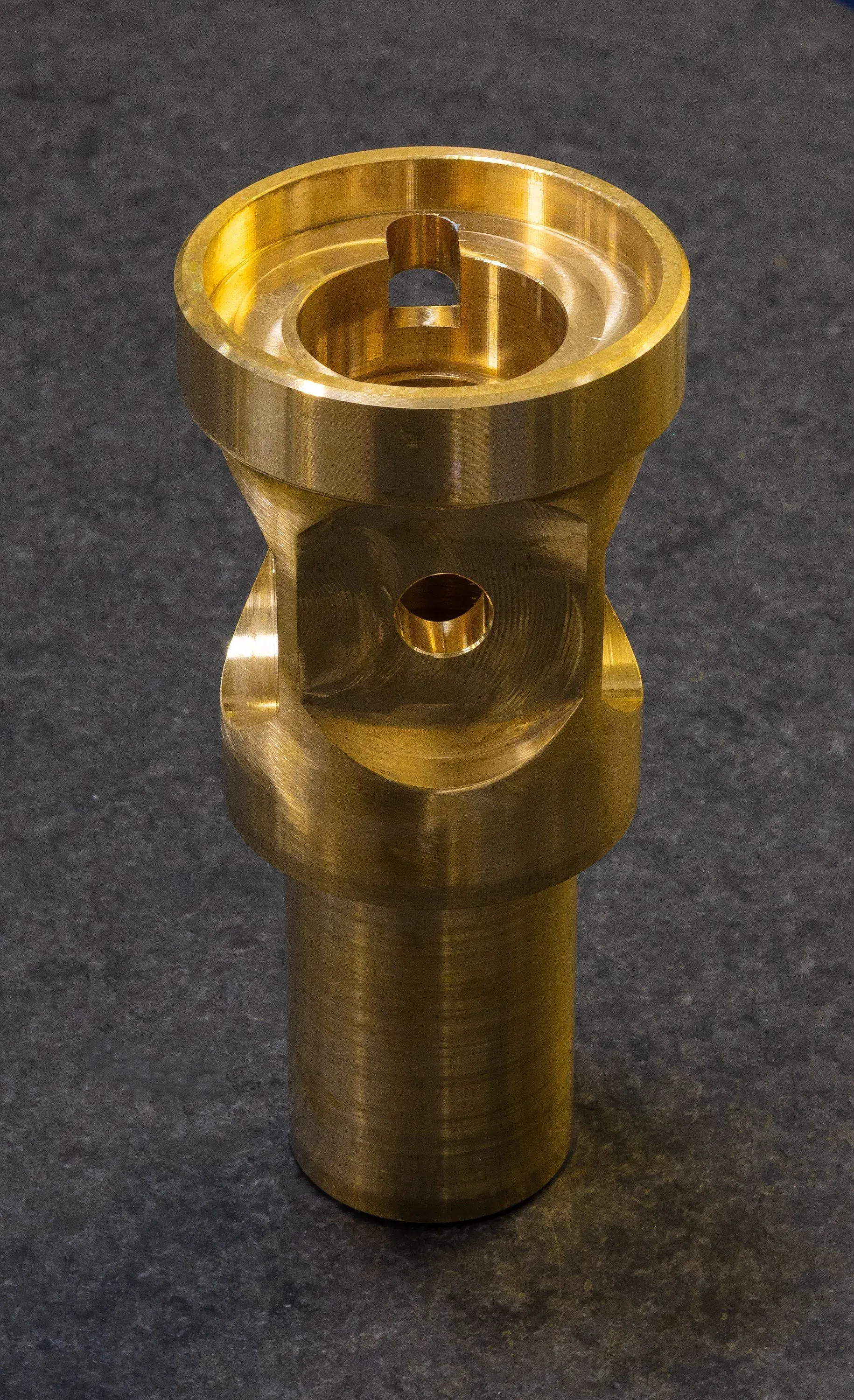 Machined brass component with internal threading