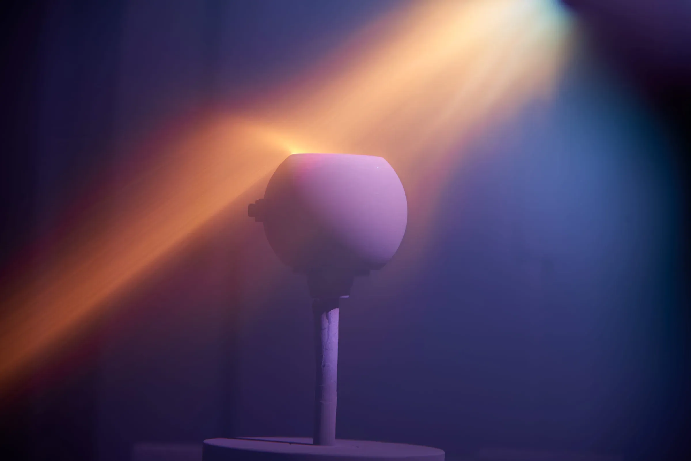 Vacuum thermal spray plume passing a ceramic-coated dome component on a fixture
