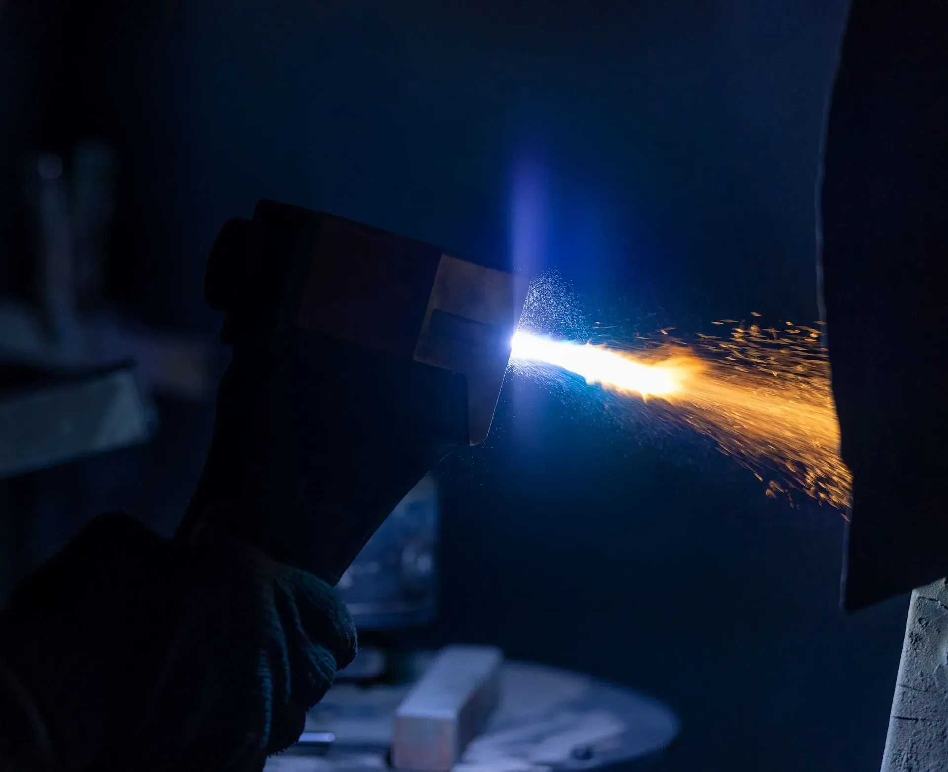 Hand-spraying a thermal spray coating onto an industrial component