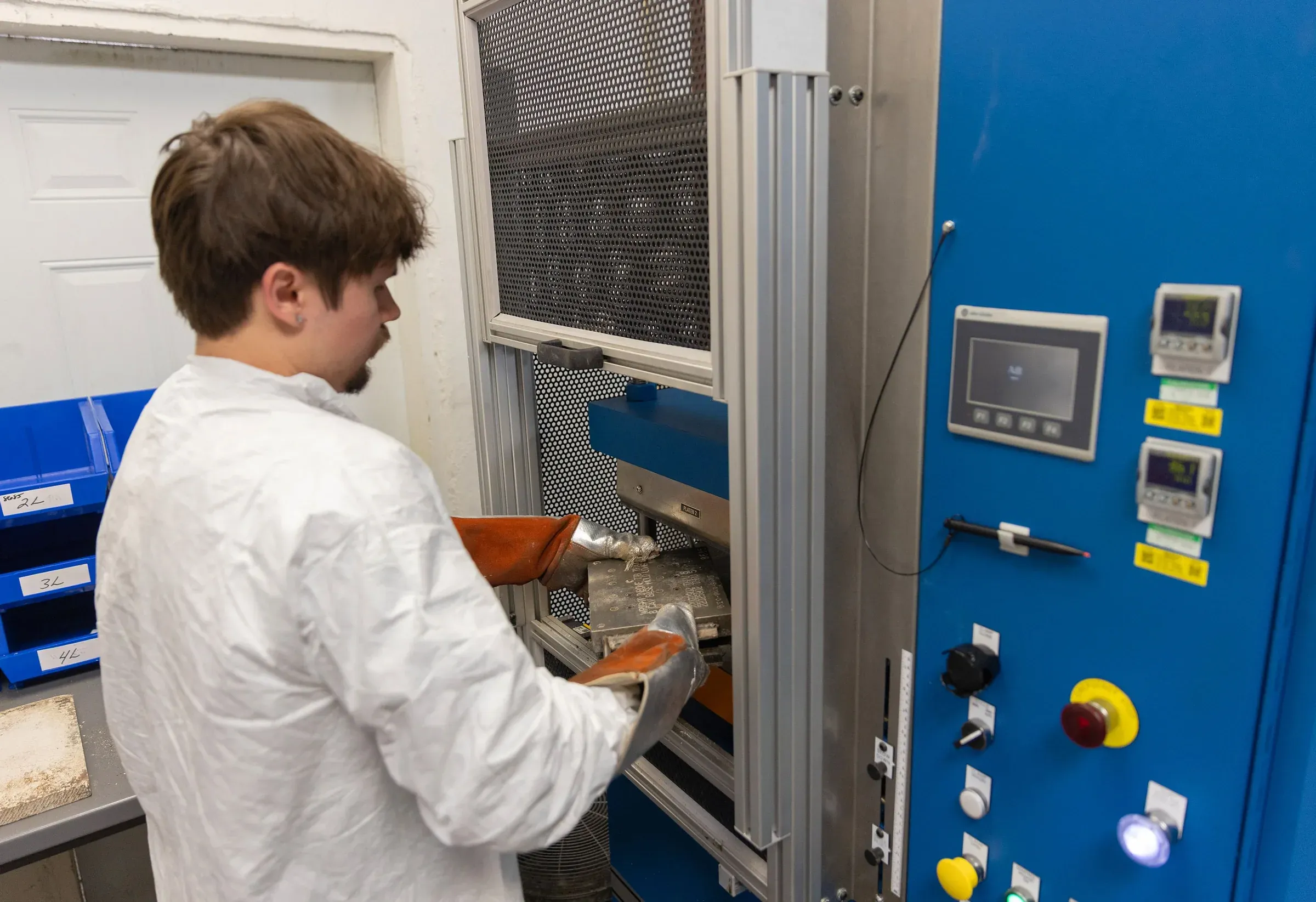 Heated compression molding press forming silicone components