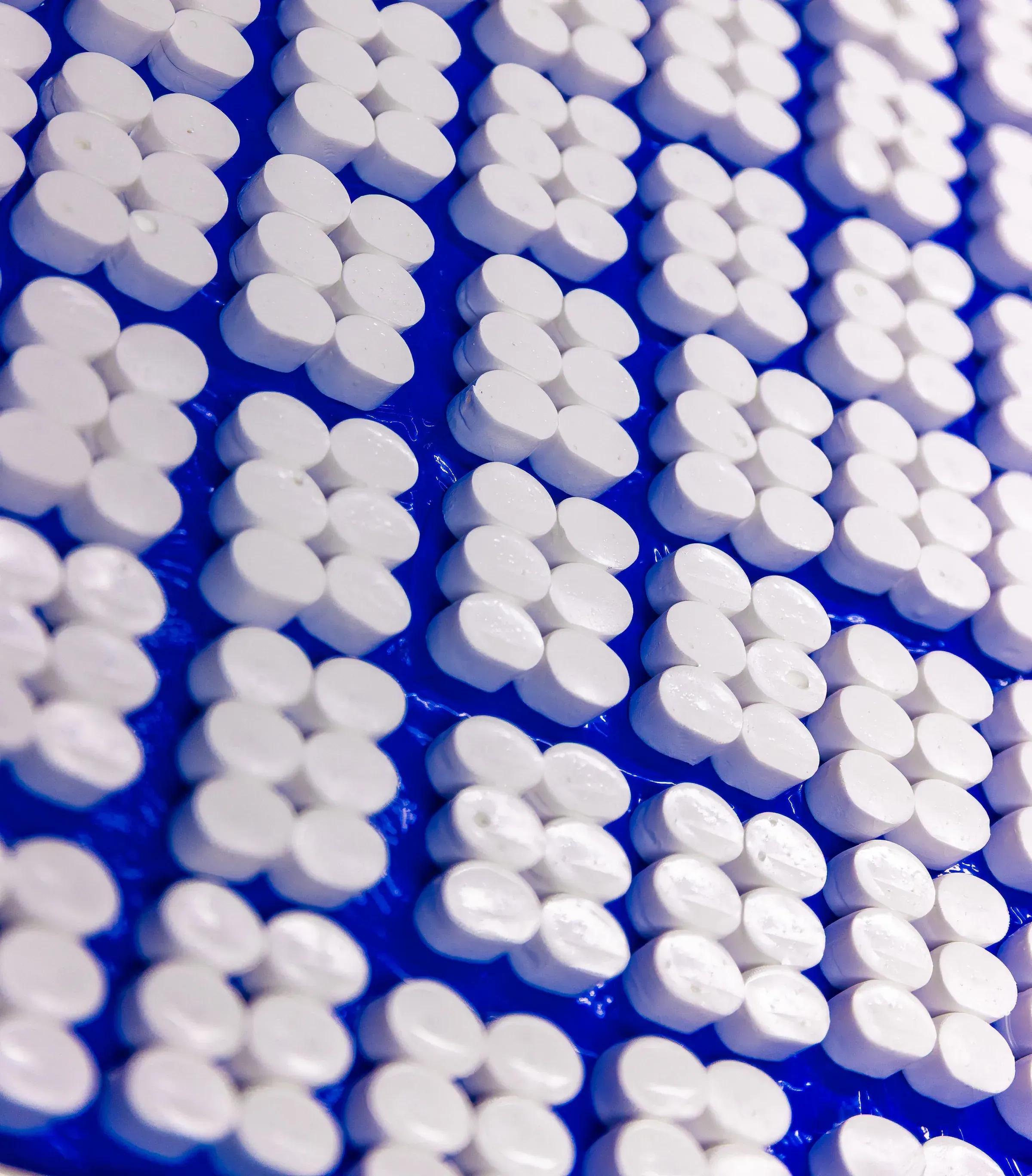Molded silicone components laid out after curing