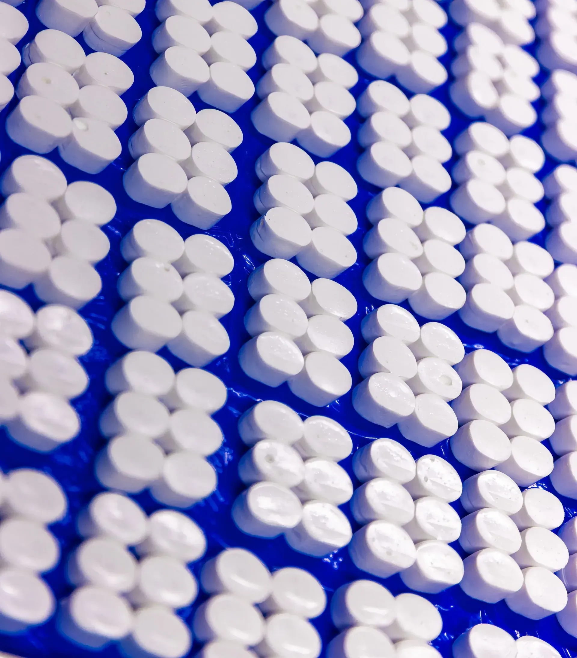 Molded silicone components laid out after curing