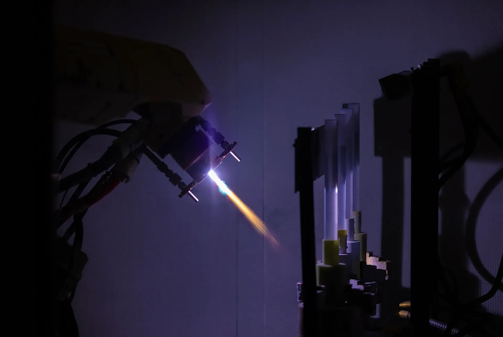 Vacuum plasma spray process in a controlled chamber