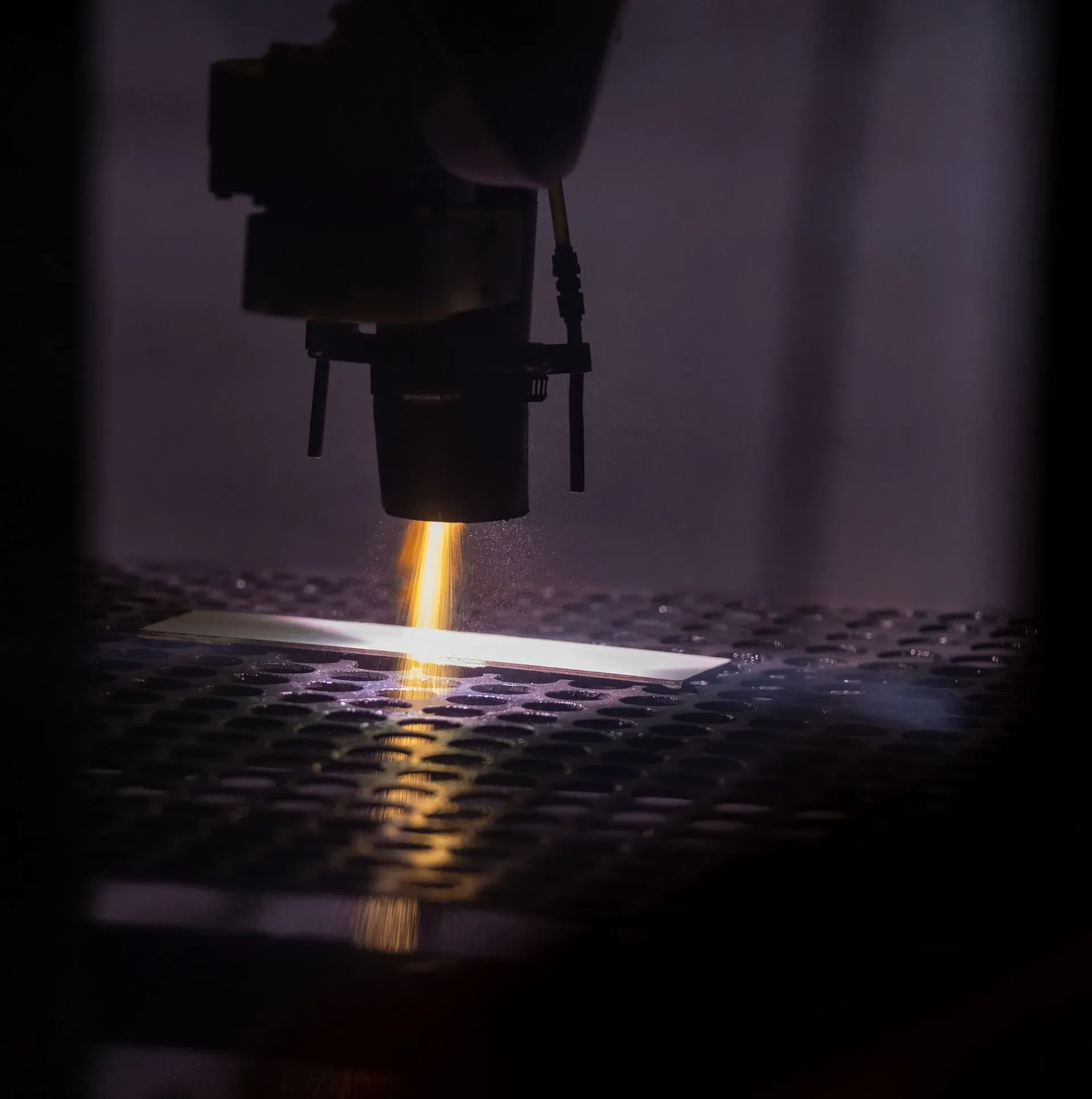 Thermal spray plume depositing coating onto a flat test coupon